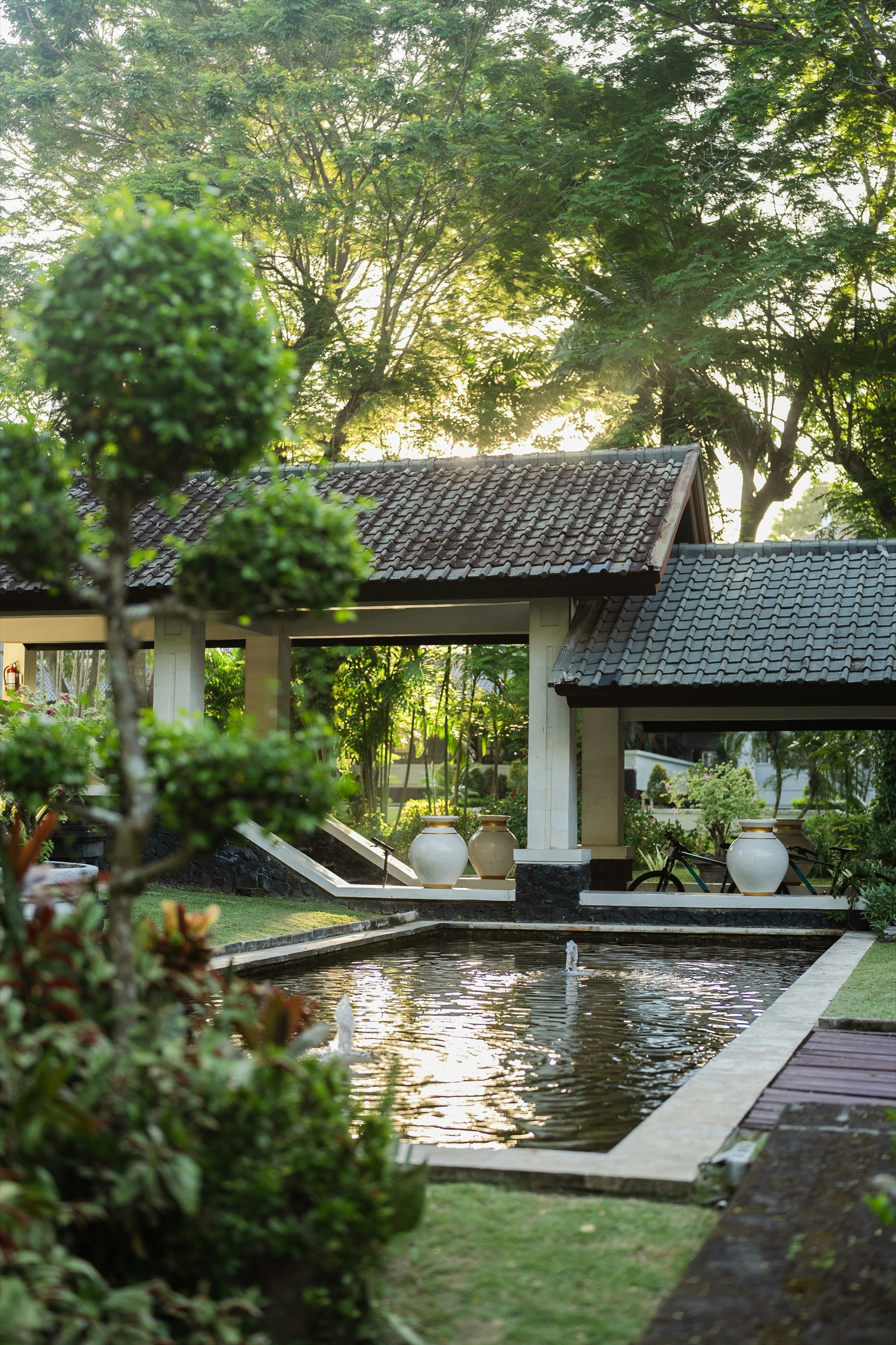 Bali villa grounds with water feature at golden hour